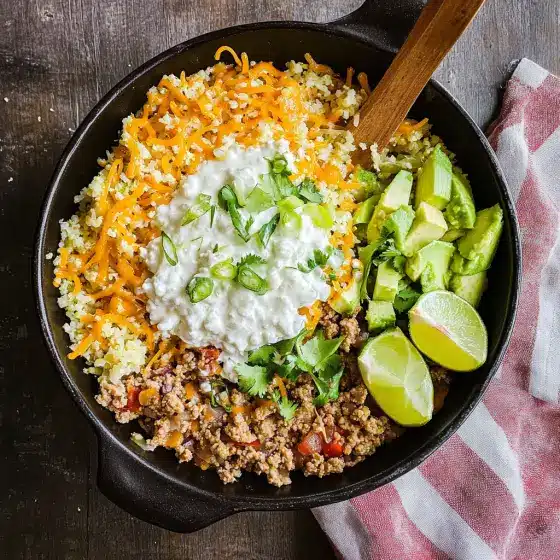 Meal prep containers with low carb taco bowl and cottage cheese